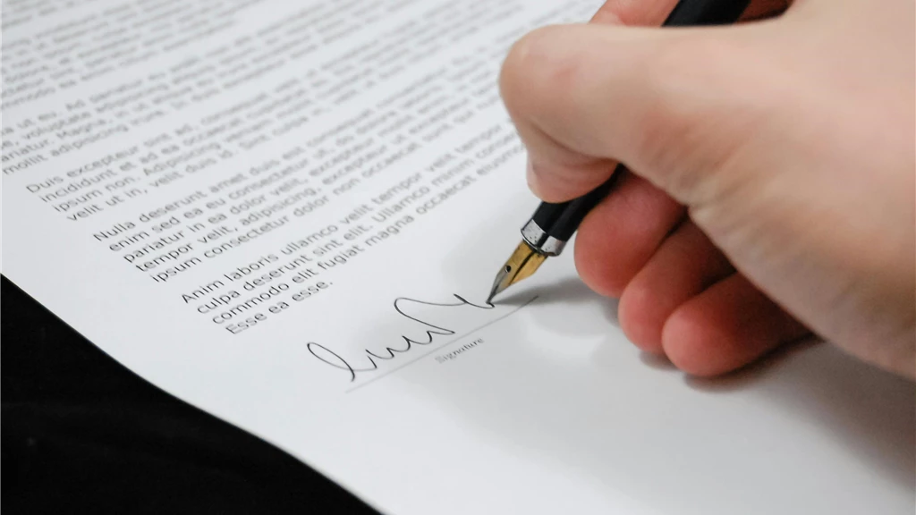 Person Signing in Documentation Paper