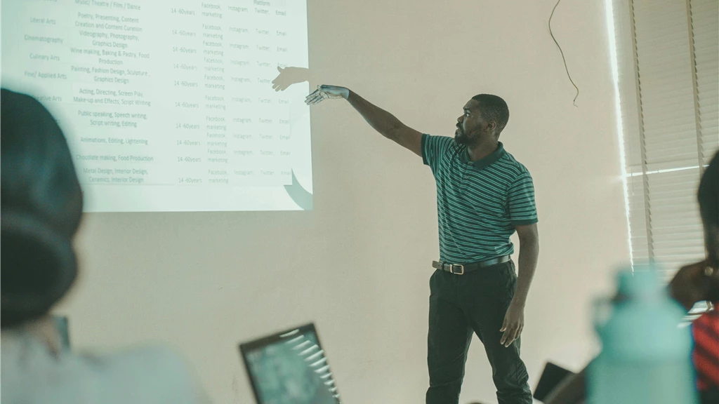 Man Showing a Graph in a Classroom